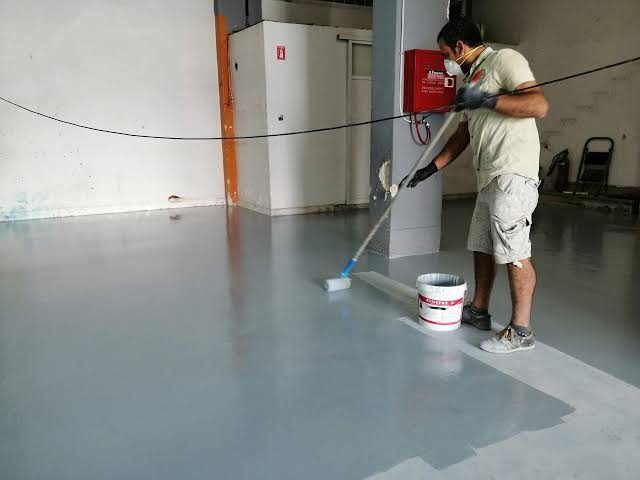 Epoxy flooring application in progress