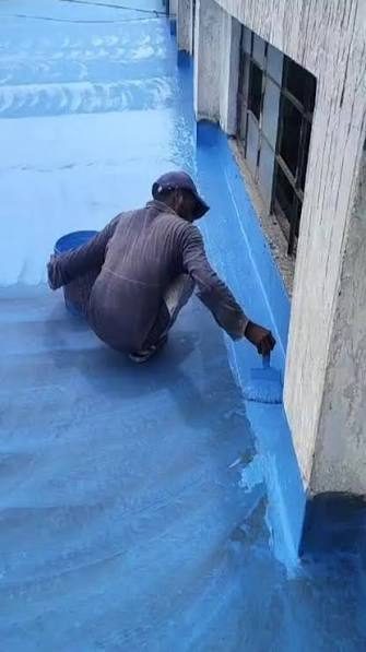 Waterproofing membrane being rolled onto a terrace